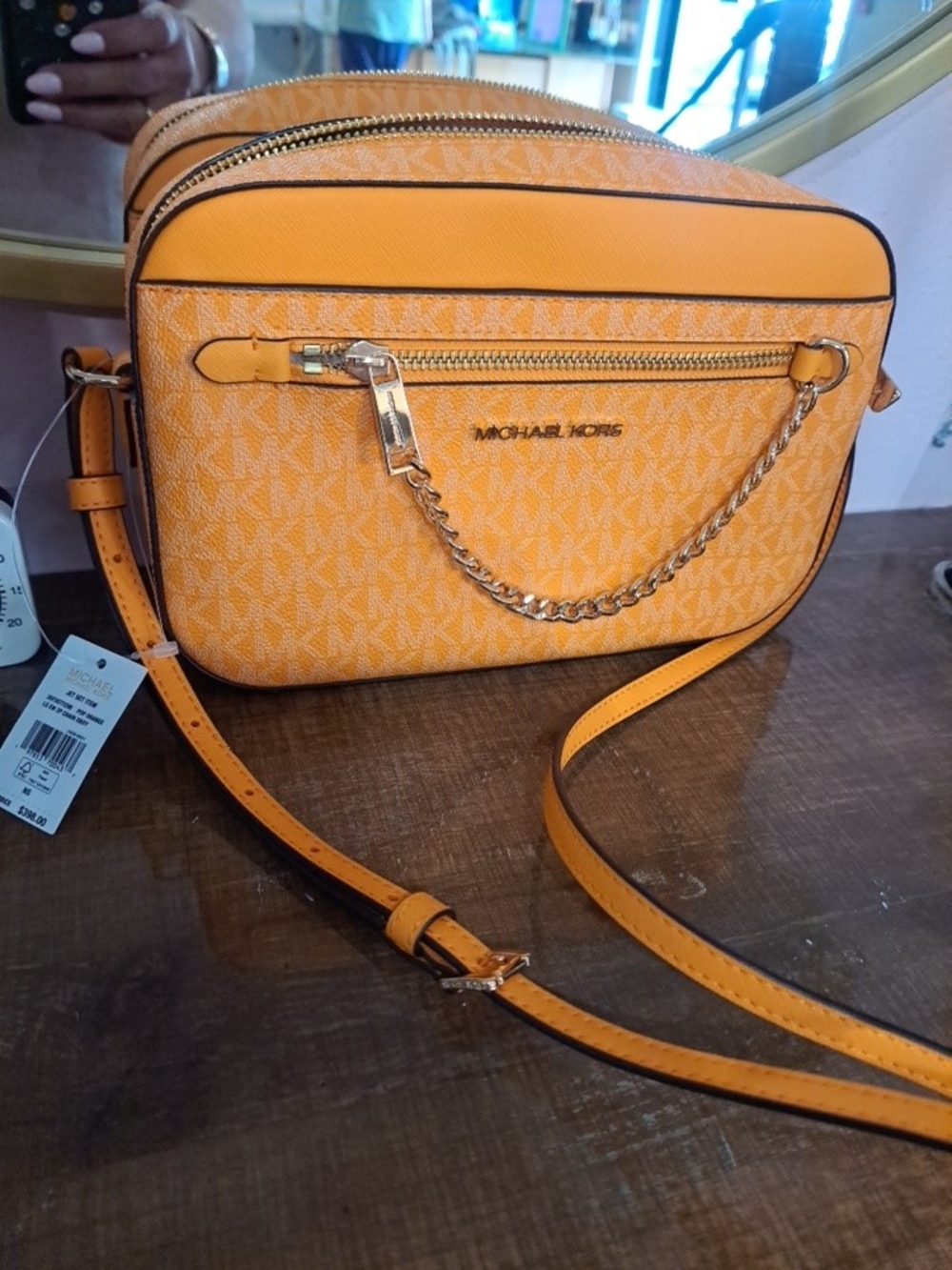 Michael Kors Orange Monogram Crossbody with Gold Chain Accent